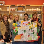 AKLS teachers with students drawings on Lithuania