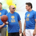 Seskine School Principal (center) holds the basketball used to open the court in 2006 and reopen in 2015. Olympic champion V.Chomicius (right)